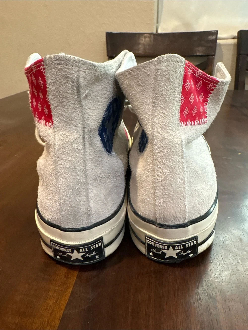 Converse Chuck Taylor’s White High Top Sneakers with Red and Blue Accents